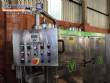 Llenadora rotativa gravimtrica de acero inoxidable con cabina