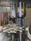 Llenadora rotativa gravimtrica de acero inoxidable con cabina