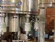 Llenadora rotativa gravim�trica de acero inoxidable con cabina