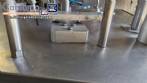 M�quina rotativa de acero inoxidable para llenado, dosificaci�n y sellado, con junta de aluminio, para tarros, vasos y botellas Delgo.